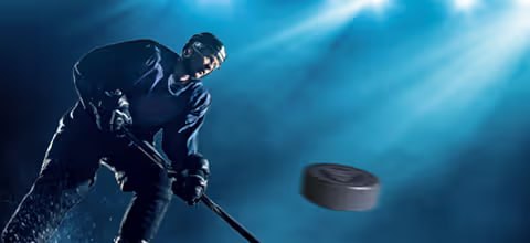 Hockey player shooting puck